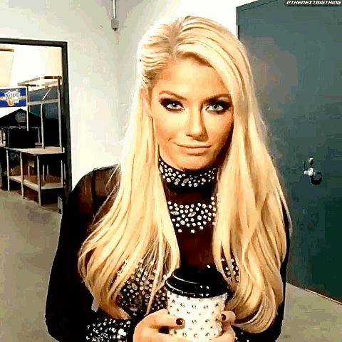 a woman with blonde hair is holding a cup of coffee in her hand .