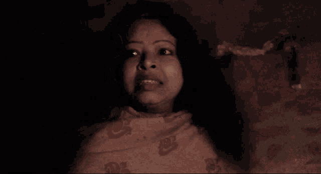 a woman in a dark room with the words did you see her tongue split