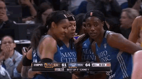 a group of women wearing mayo clinic uniforms are hugging each other