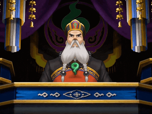 a man with a beard and a green pendant on his chest stands in front of a podium
