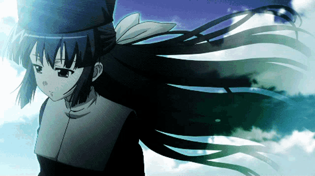 a girl with long black hair and a blue hat