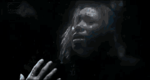 a person 's hand is reaching out to touch a window with the words " yah elaaah " written on it