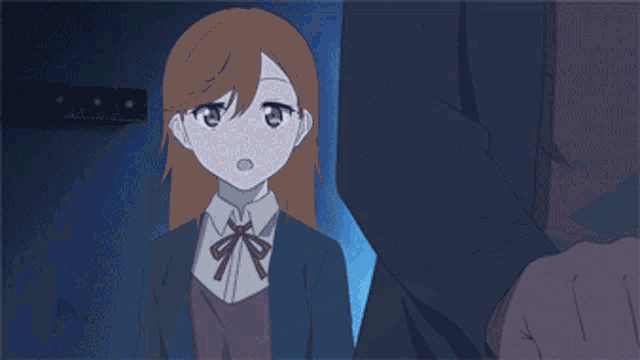 a close up of a girl 's face with a surprised look on her face