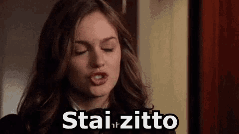 a close up of a woman with her eyes closed and the words stai zitto written on her face .