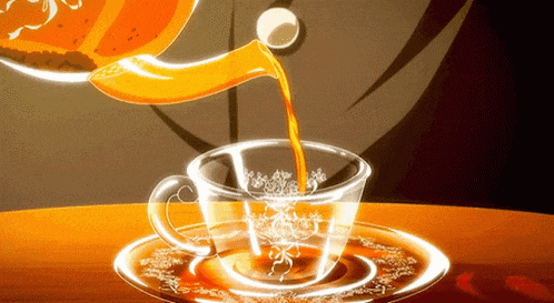 tea is being poured into a cup on a saucer
