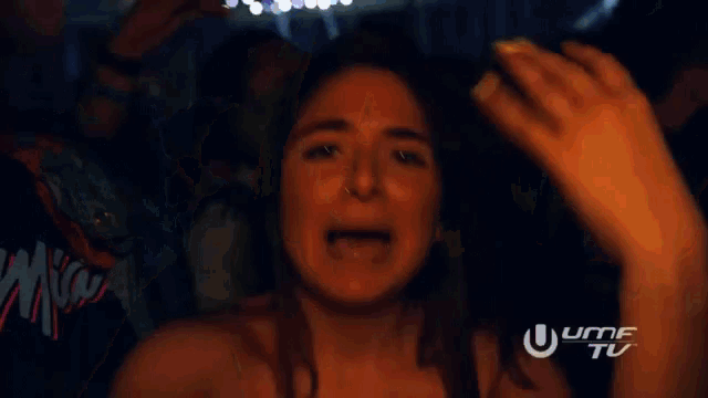 a blurry photo of a woman with the word umf on the bottom right