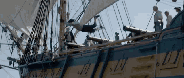 a ship with a few cannons on the side and the number 11 on the side of it