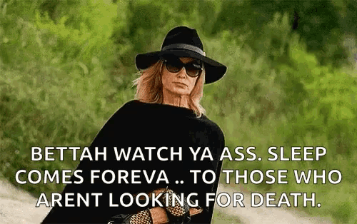 a woman wearing a black hat and sunglasses says bettah watch ya ass sleep comes foreva to those who arent looking for death