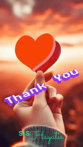 a person holding a heart with the words thank you written on it