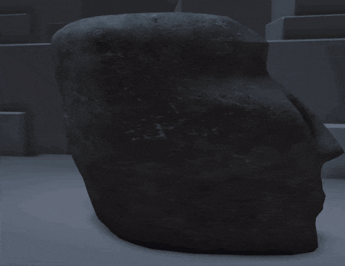 a statue of a man 's face is sitting on a table