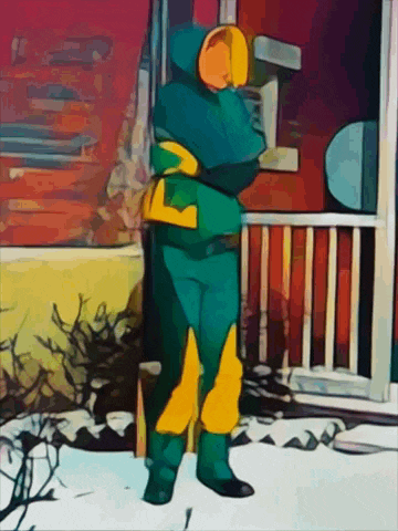 a person in a green and yellow costume with the letter l on their chest