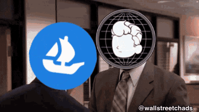 a man in a suit and tie stands next to another man with a sailboat icon on his head
