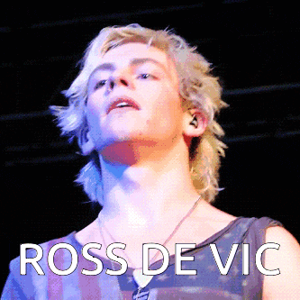 a close up of a person 's face with the name ross de vic on it