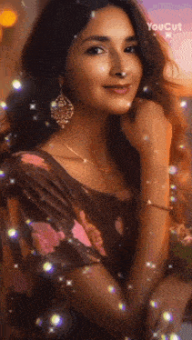 a woman in a floral dress is surrounded by sparkly lights