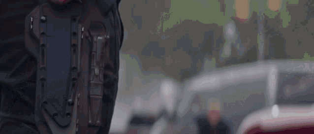 a close up of a person holding a knife in their pocket .