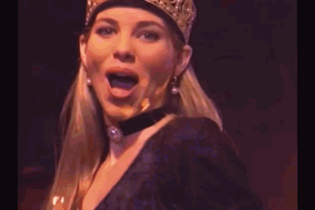 a woman wearing a hat with xoxo on it