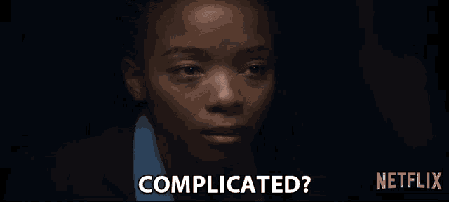 a close up of a woman 's face with the words complicated on the bottom
