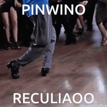 a man is dancing on a dance floor with the words pinwino recliaoo written above him