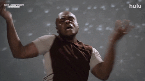 a man is dancing in front of a mid century modern background