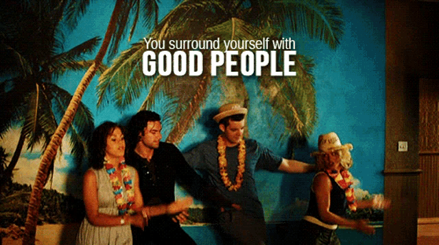 a group of people dancing in front of a wall that says you surround yourself with good people