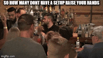 a group of people sitting at a bar with the caption so how many dont have a set up raise your hands