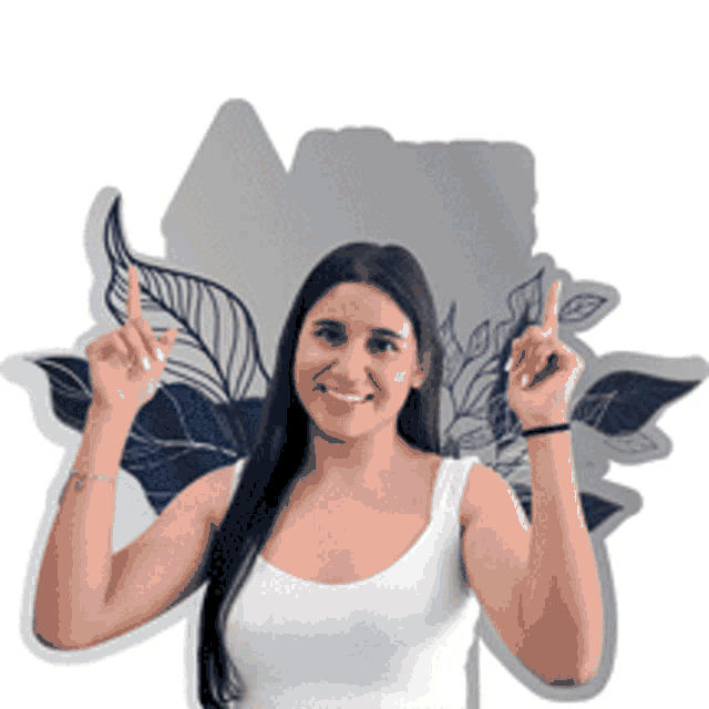 a woman in a white tank top points upwards