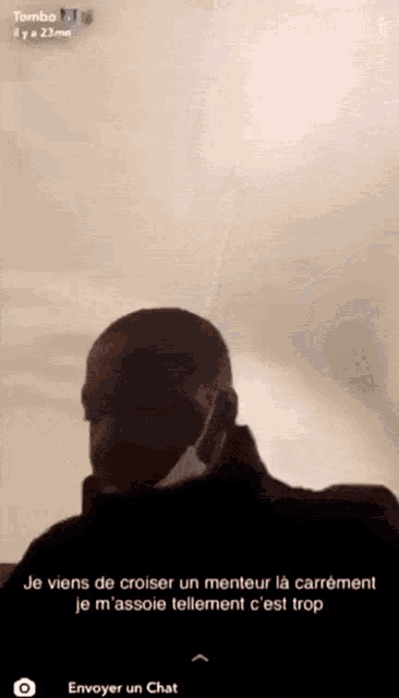 a screenshot of a man wearing a face mask with a caption that says tombo