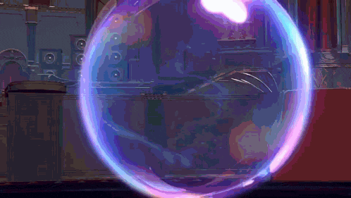 a purple and blue bubble is floating in the air