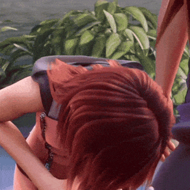 a close up of a person 's head with a plant in the background