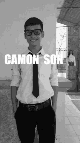 a young man wearing glasses and a tie with the name canon son on the bottom