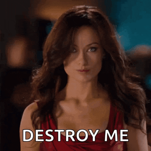 a woman in a red dress with the words destroy me on her chest