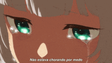 a close up of a person 's eyes with tears coming out of them