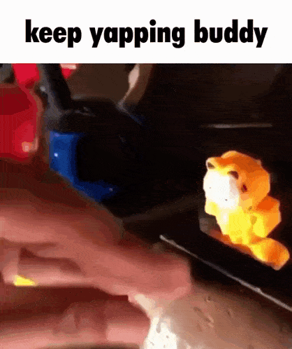 a person is holding a stuffed animal with the words keep yapping buddy above it