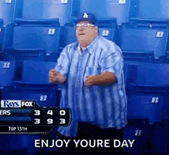 a man is dancing in a stadium with the words enjoy your day written on the bottom
