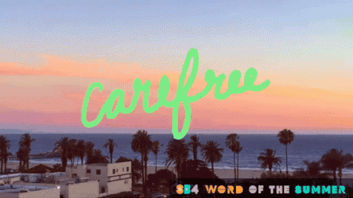 the word carefree that is on a beach background