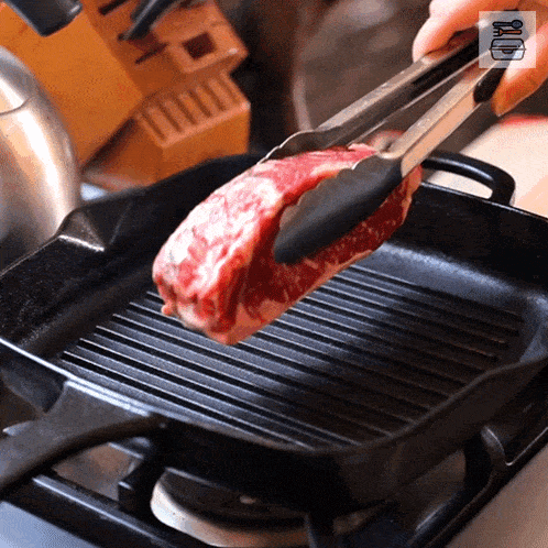 Putting The Meat In The Pan Food Box Hq GIF - Putting The Meat In The Pan Food Box Hq Cooking Steak GIFs