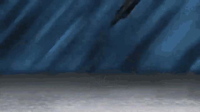 a person 's leg is shown in a blurry picture with a blue background