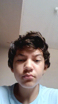 a close up of a person 's face with a blurred background .