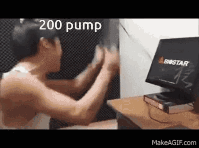 a man is standing in front of a computer with the words 200 pump written on it .