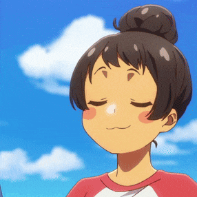 a girl with her eyes closed and a bun in her hair