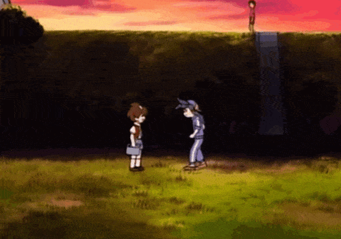 a boy and a girl are standing in a grassy field with trees in the background