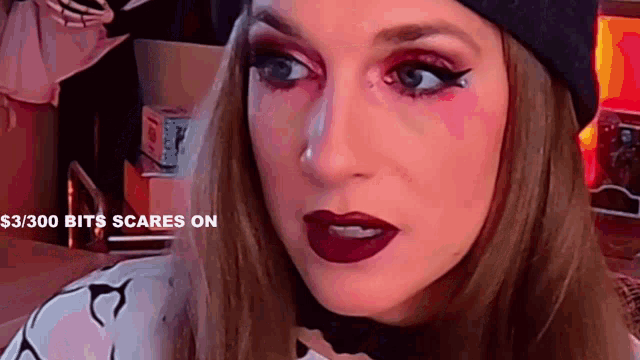a woman is wearing a black hat and red lipstick with the words $ 3 / 300 bits scares on above her