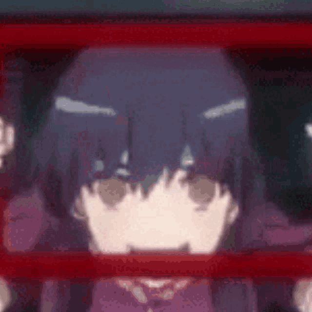 a close up of a person 's face with a red line behind them .