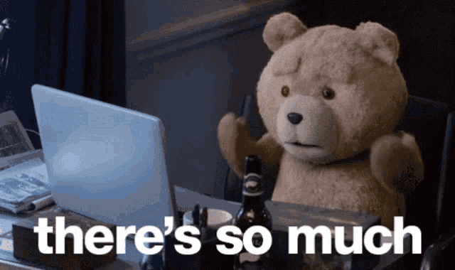 a teddy bear sitting in front of a laptop with the words " there 's so much " next to it