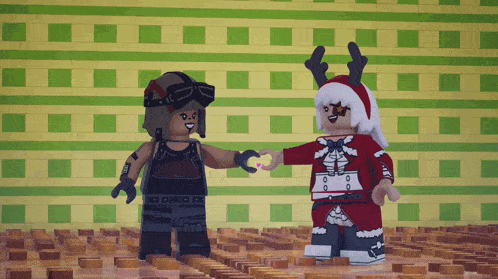 two lego figures are standing next to each other and one is wearing a reindeer hat