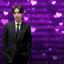 a man in a suit and tie is standing in front of a purple background with hearts and the word yoong