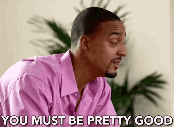 a man in a pink shirt is saying that he must be pretty good