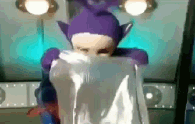 a cartoon character is holding a white cloth in front of his face .