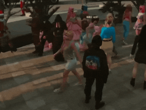 a woman in a bikini is doing a handstand on the floor