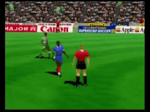 a soccer game is being played on a video game with advertisements for canon and apple